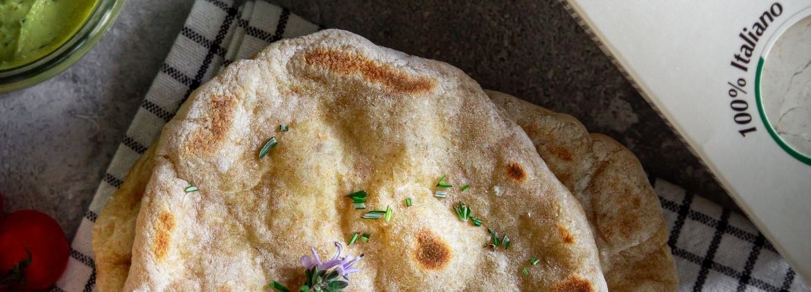 Apulian cappelli wheat flat bread with cherry tomatoes